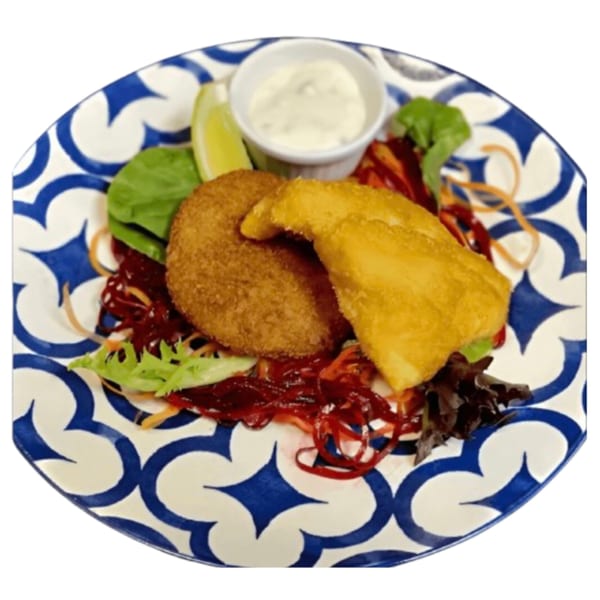 Crispy fried fish and a round croquette with salad, lime, and dipping sauce on a patterned plate.